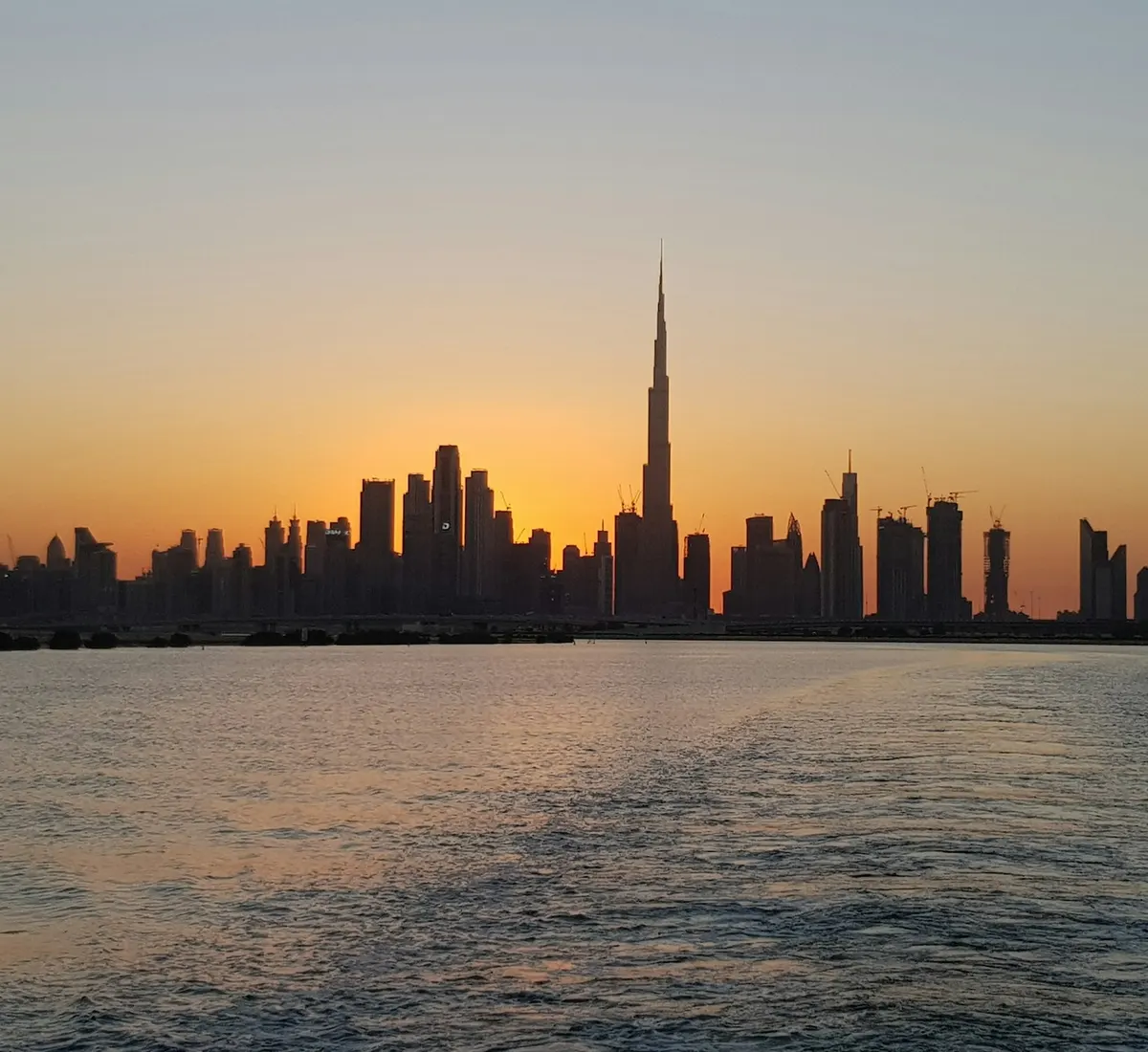 Dubai skyline and Burj Khalifa at sunset